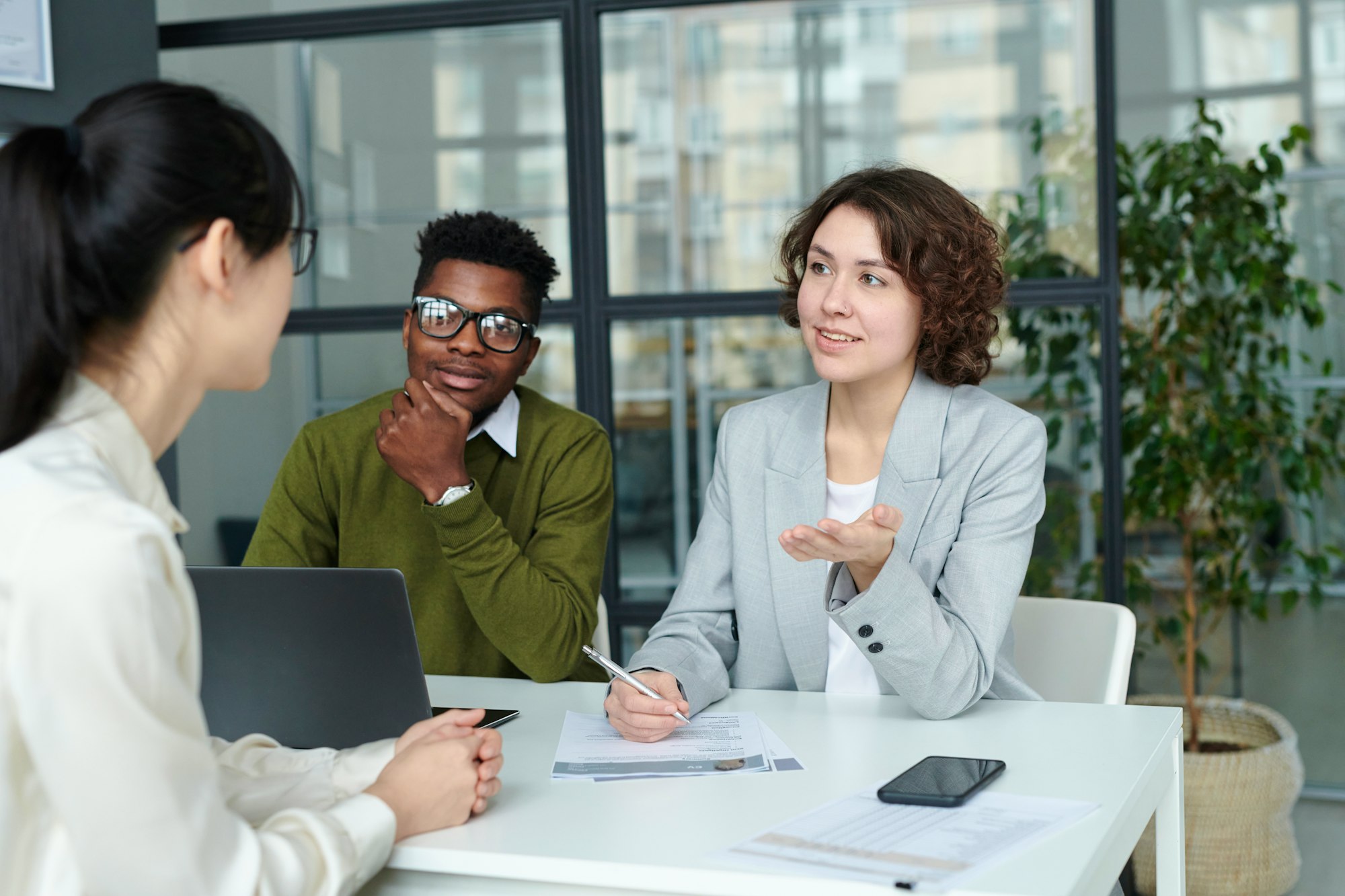 People Discussing Managed Services In Office