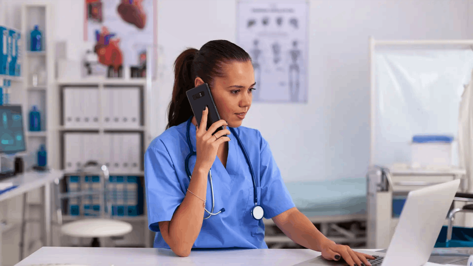 Nurse on phone at hospital desk