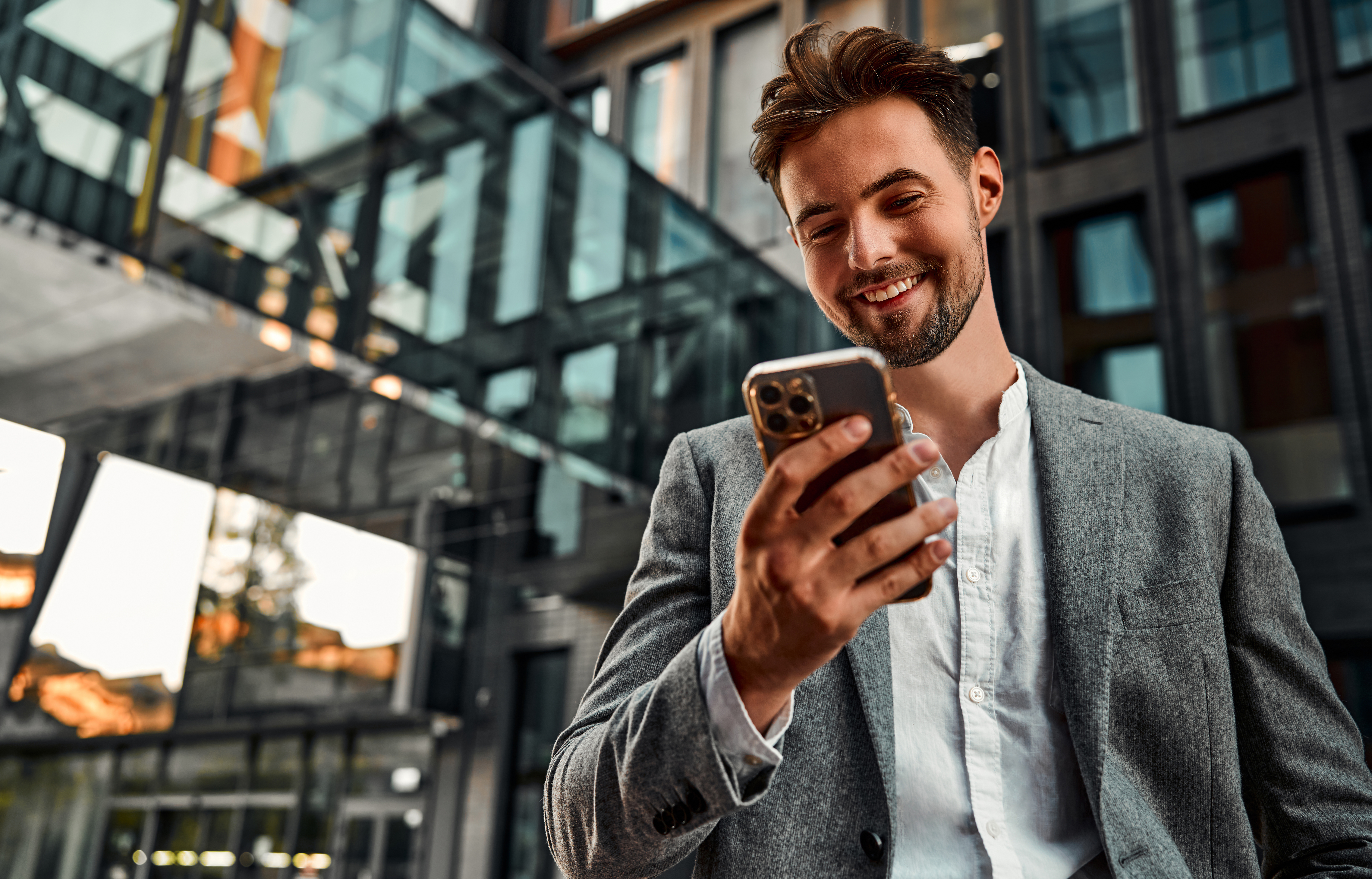 Man Smiling At Phone Showing 8x8 Licenses