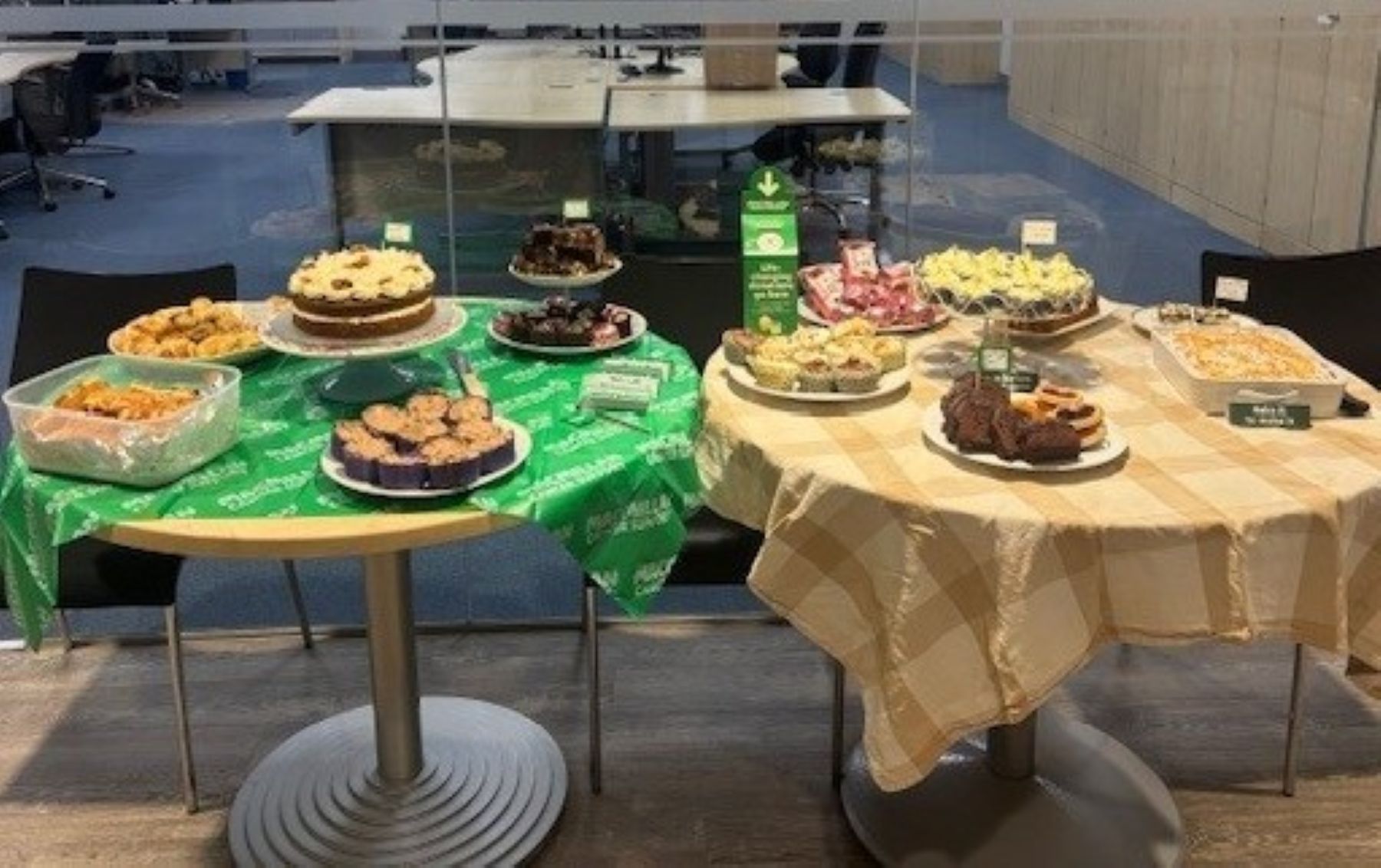 Macmillan homemade cakes and treats on tables