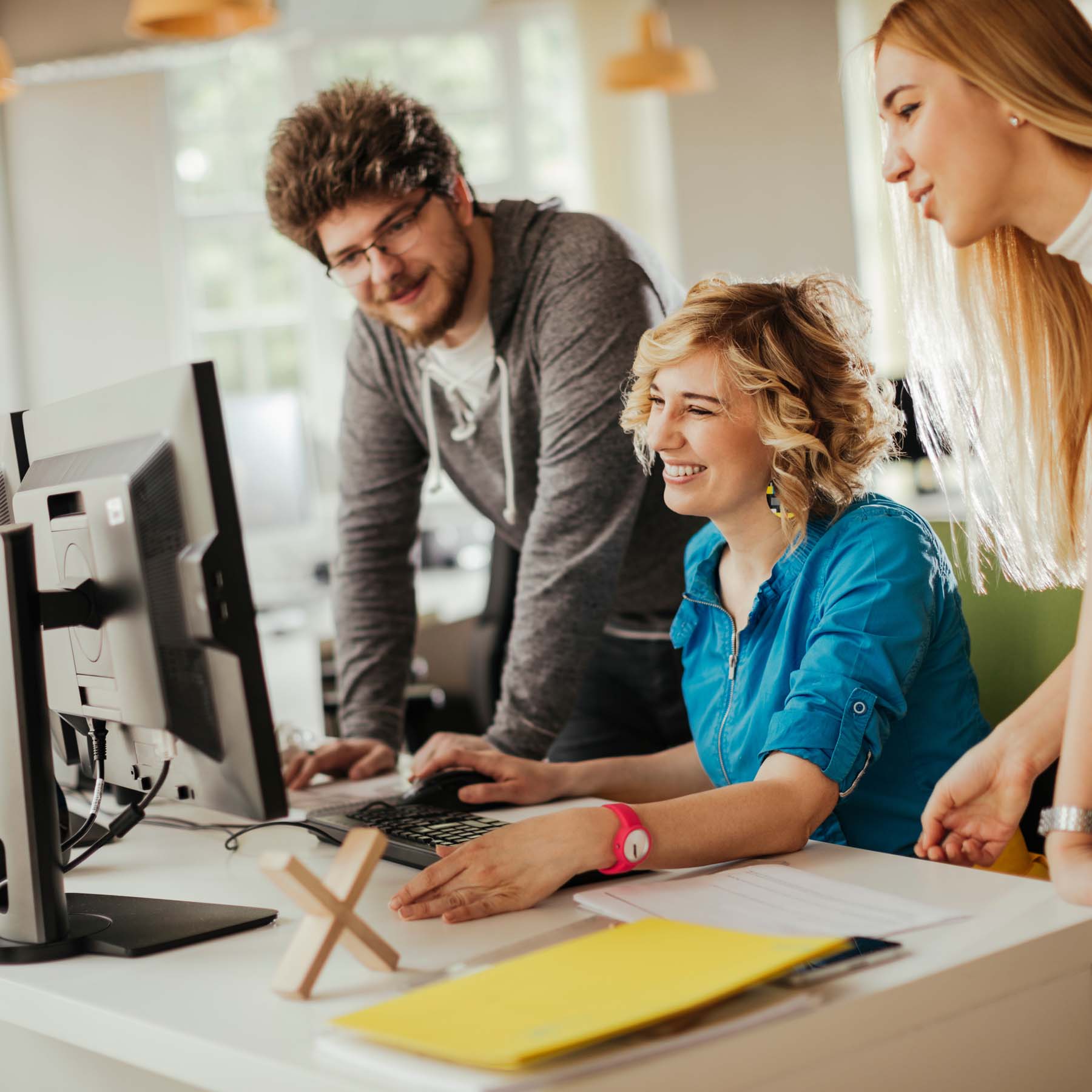 Colleagues looking at computer screen