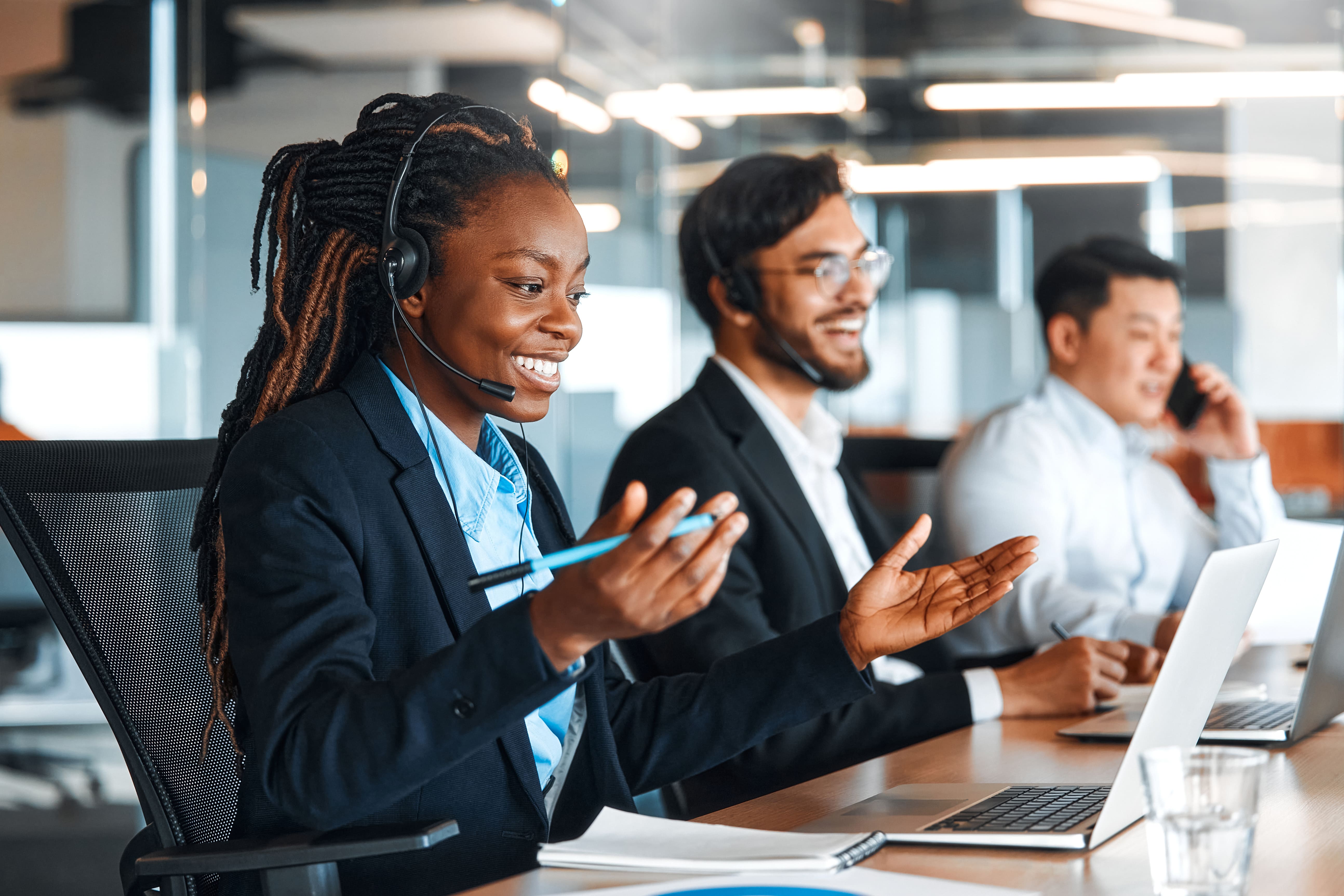 Contact Centre Colleagues smiling on phone to customer