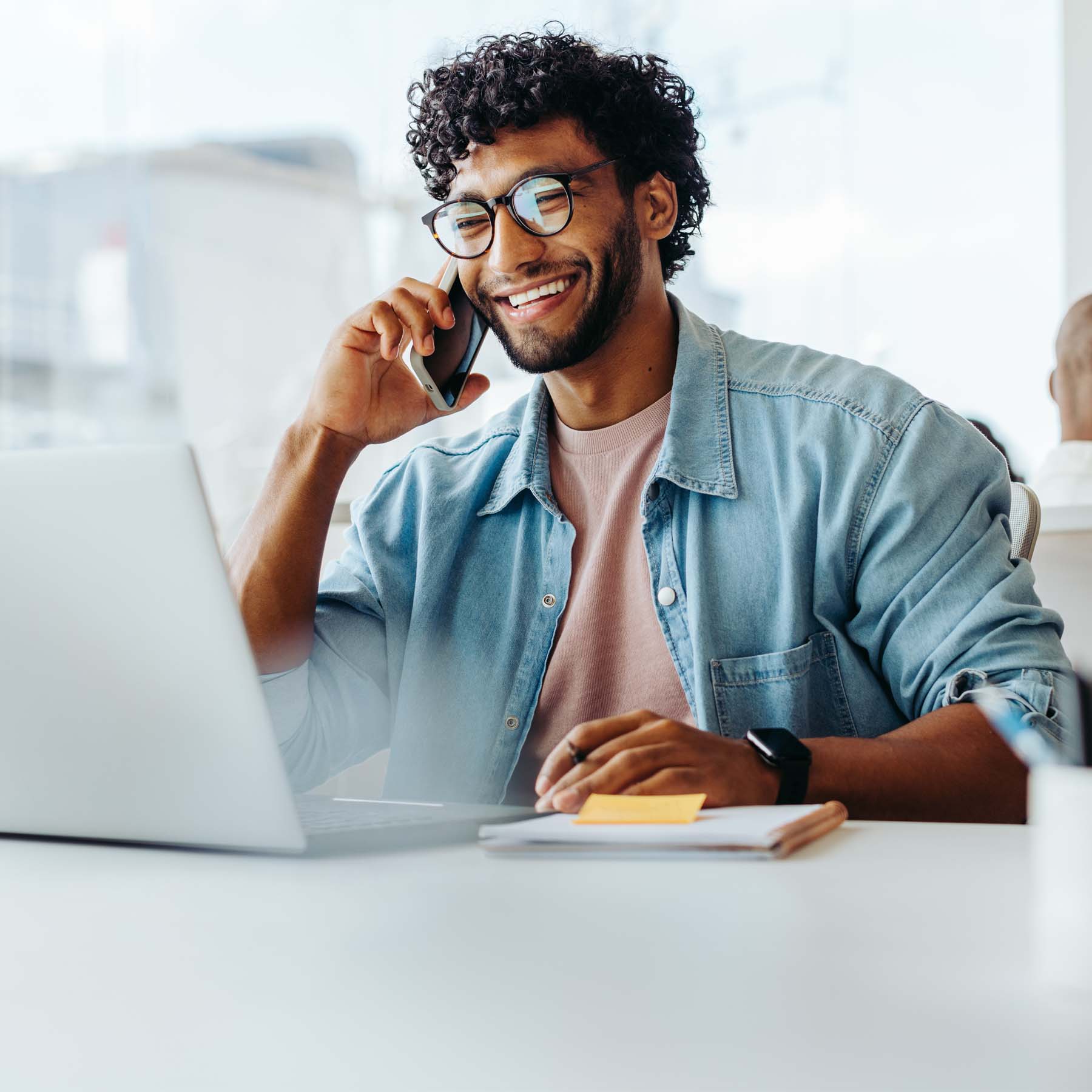 Man on mobile phone laughing and smiling