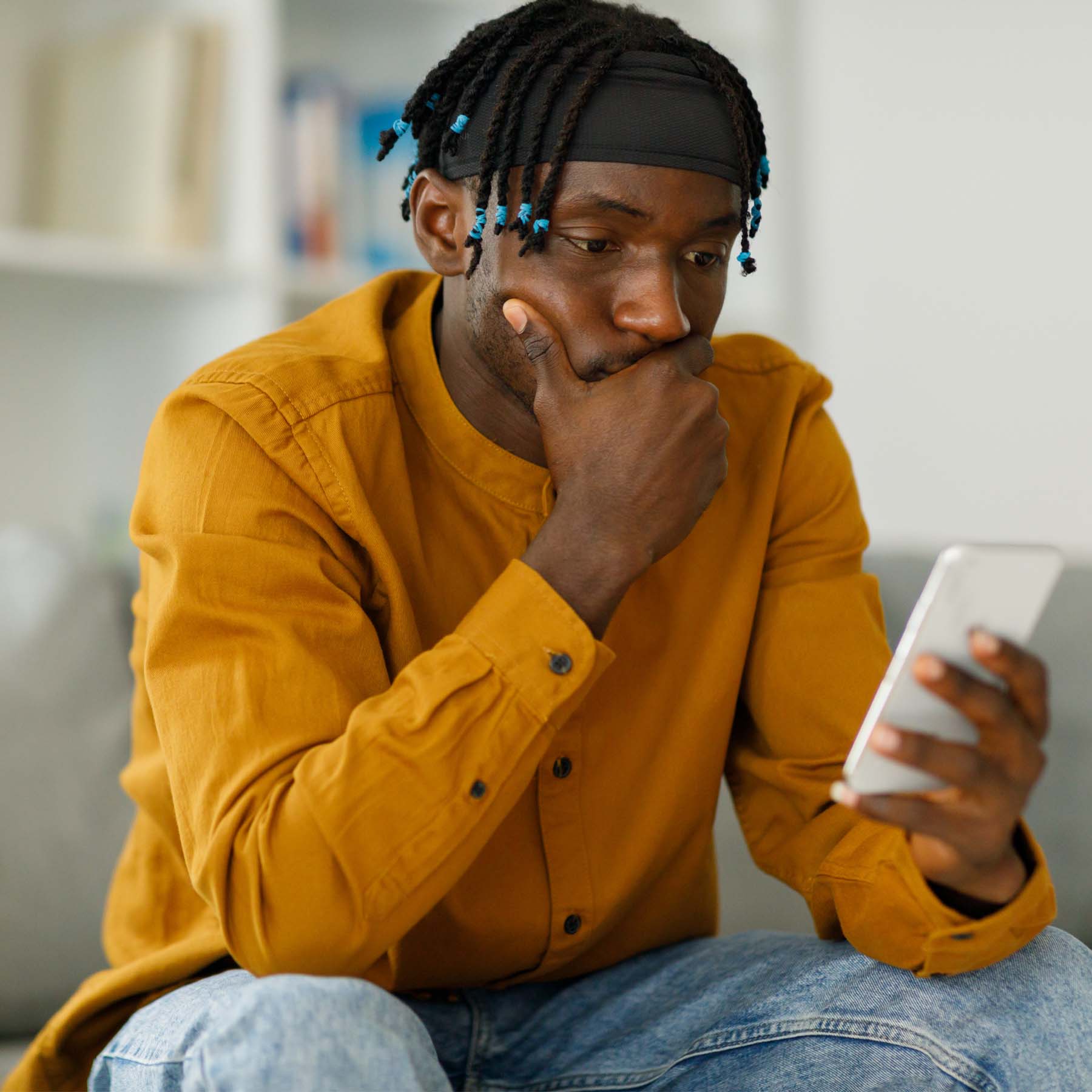 Man on phone looking concerned