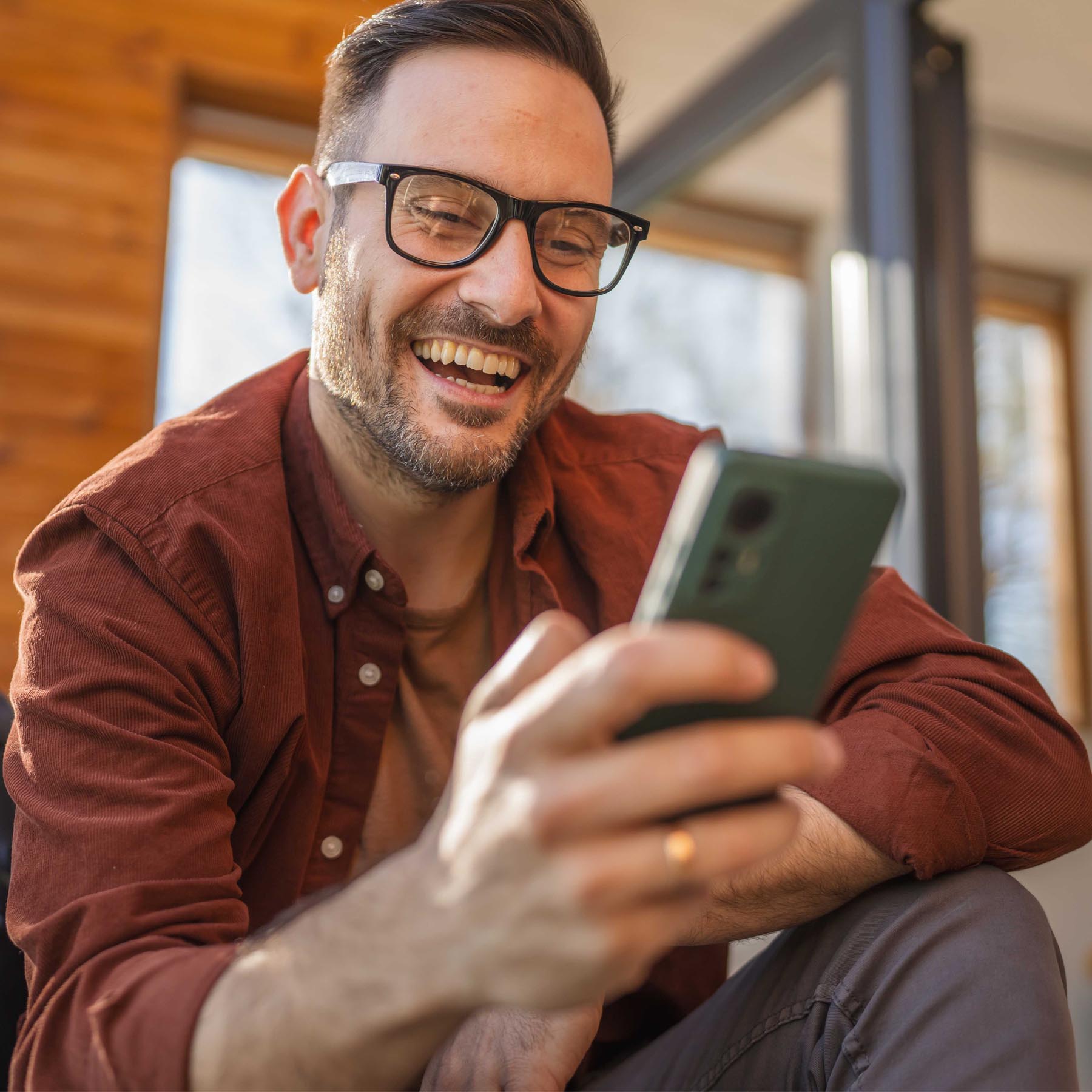 Man on phone smiling
