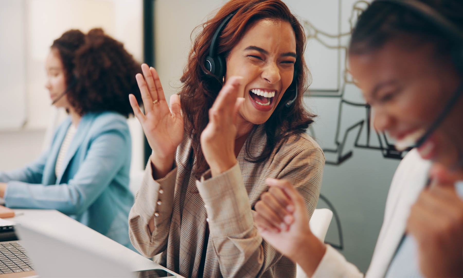 colleagues in call centre laughing