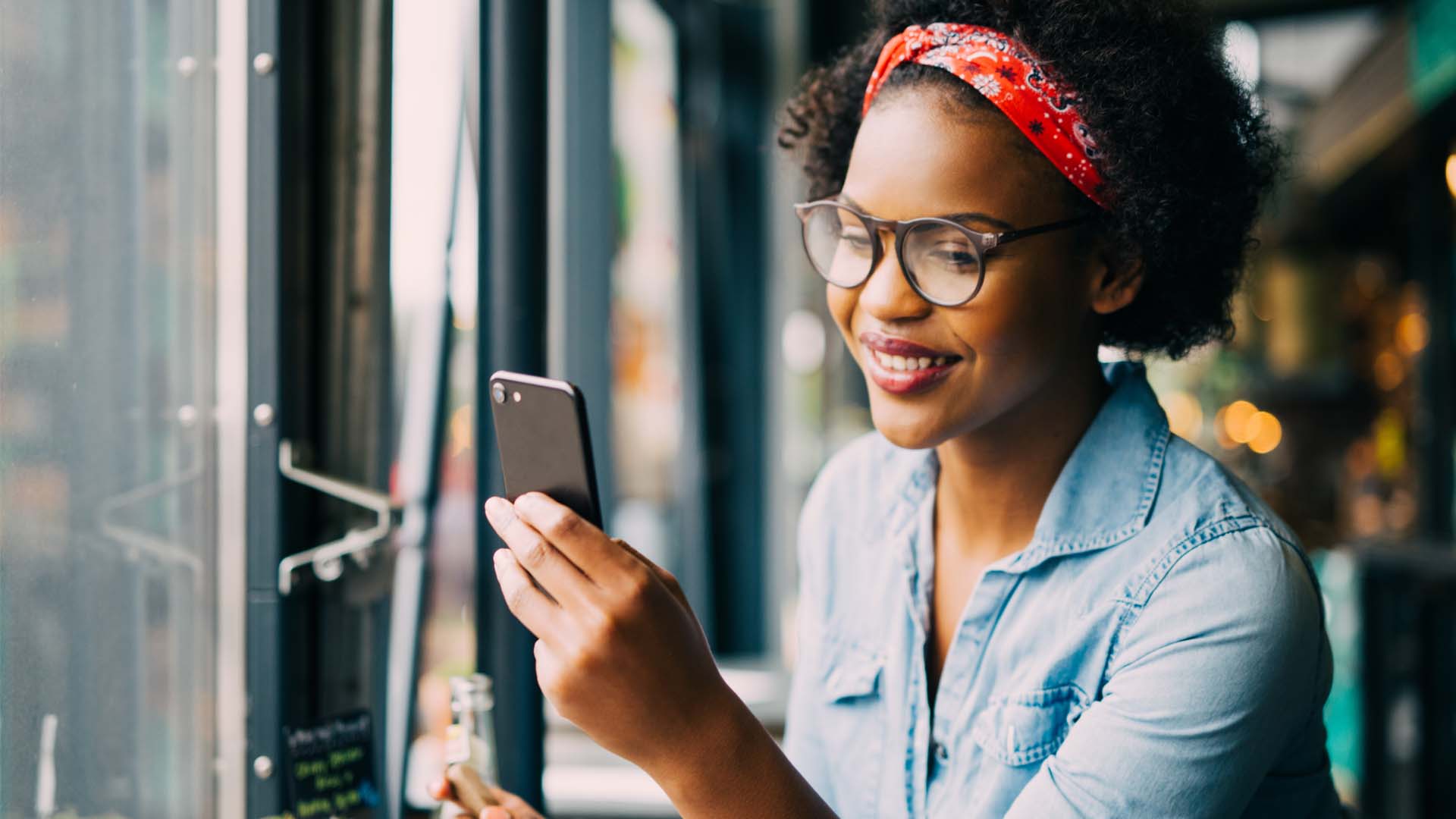 Woman smiling at phone