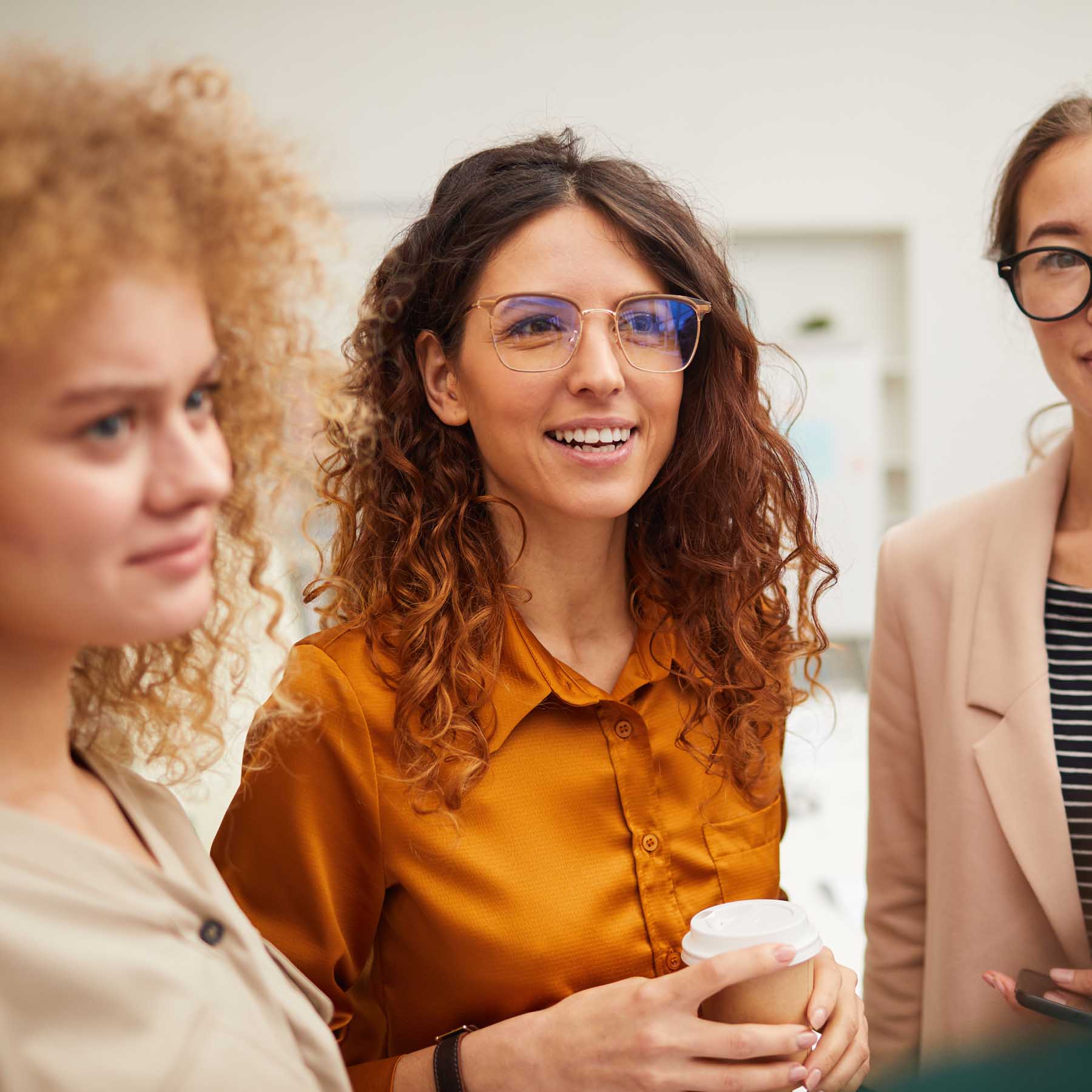 Women friends smiling coffee