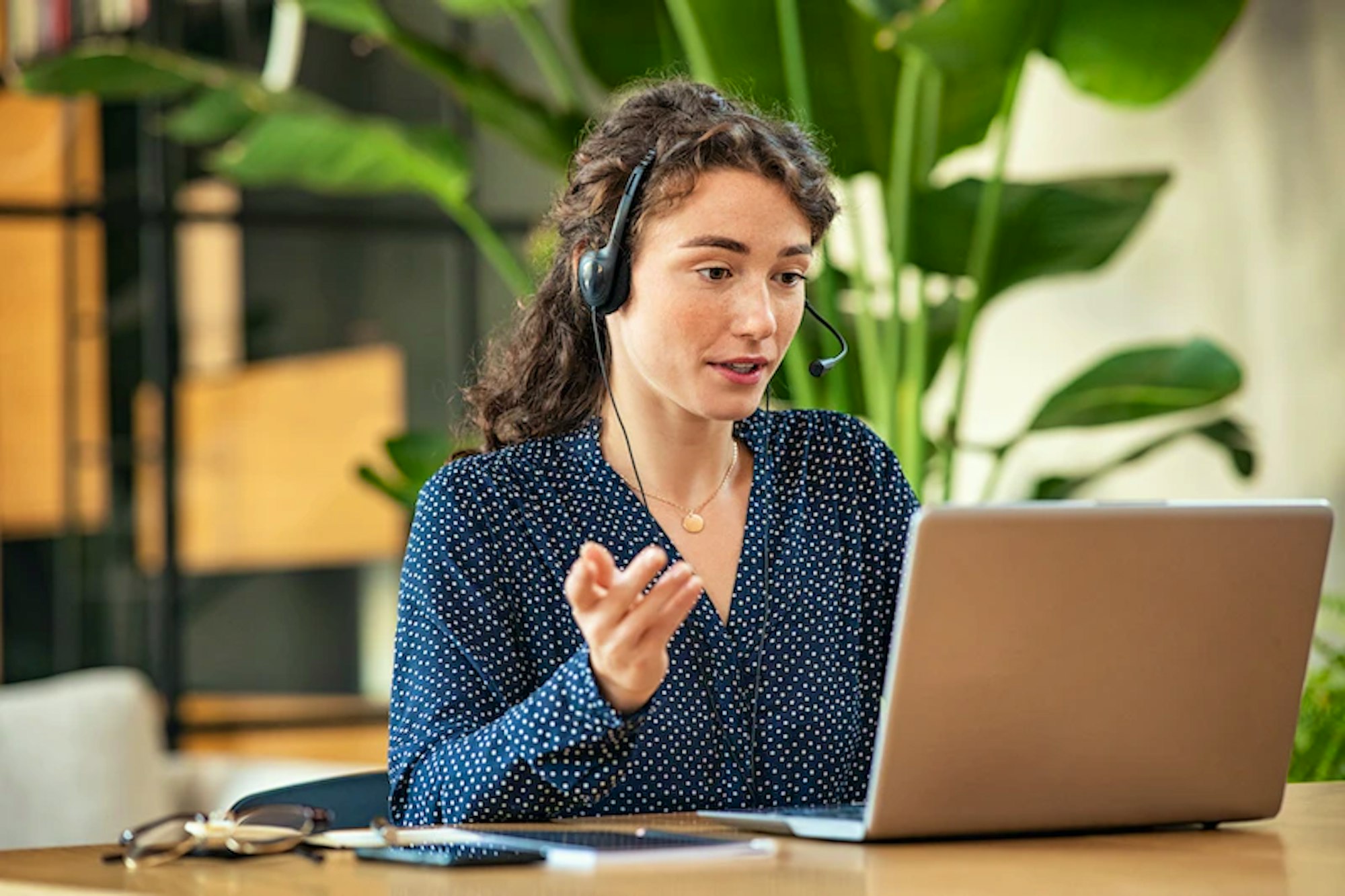Woman On Phone On Laptop