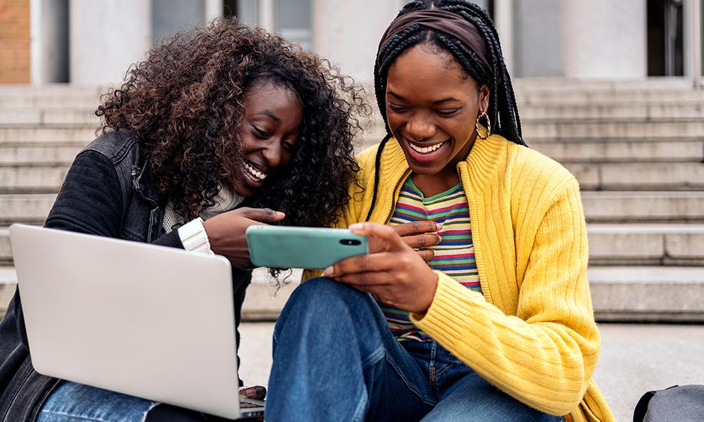 International Students Sitting On Grass