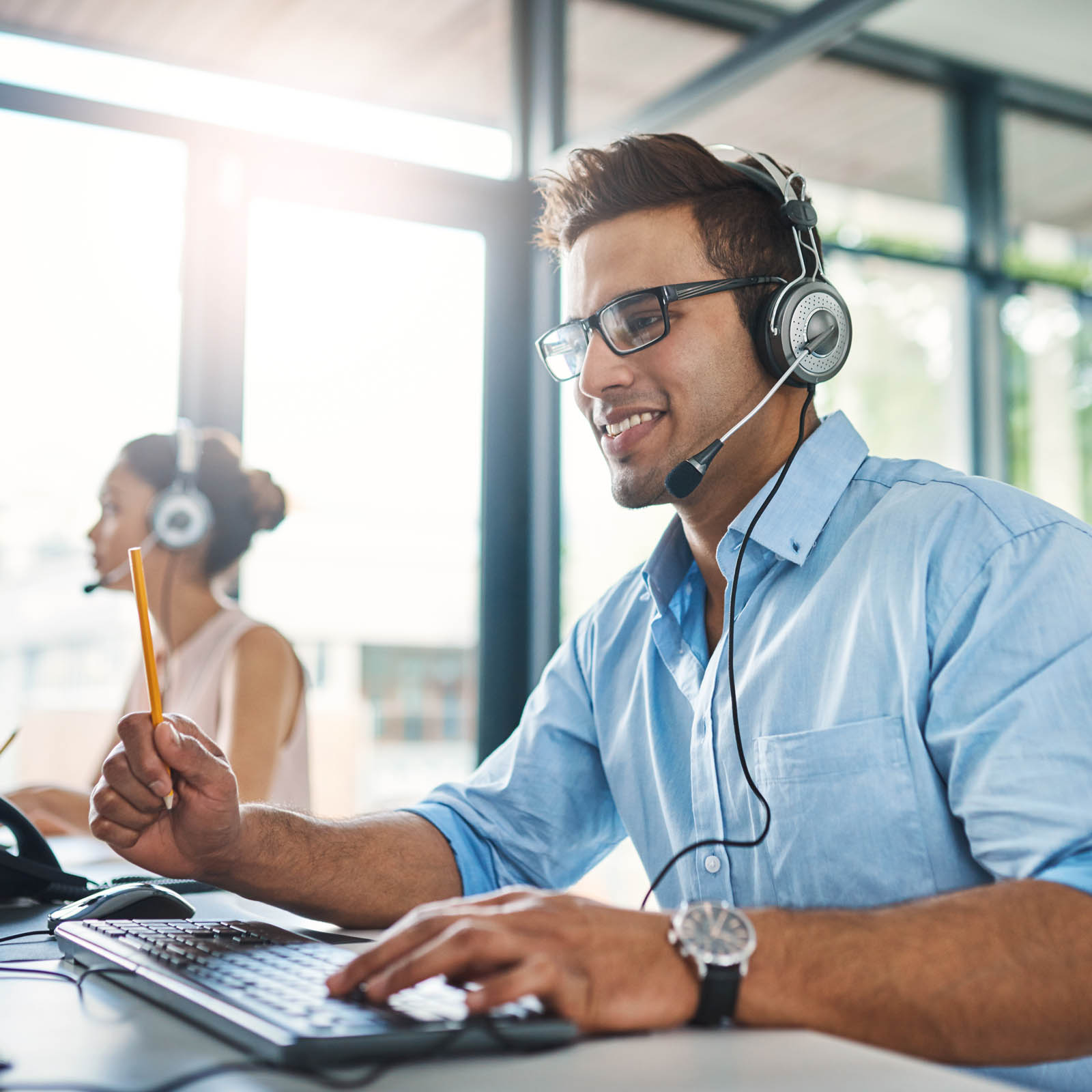 Male customer service agent on headset