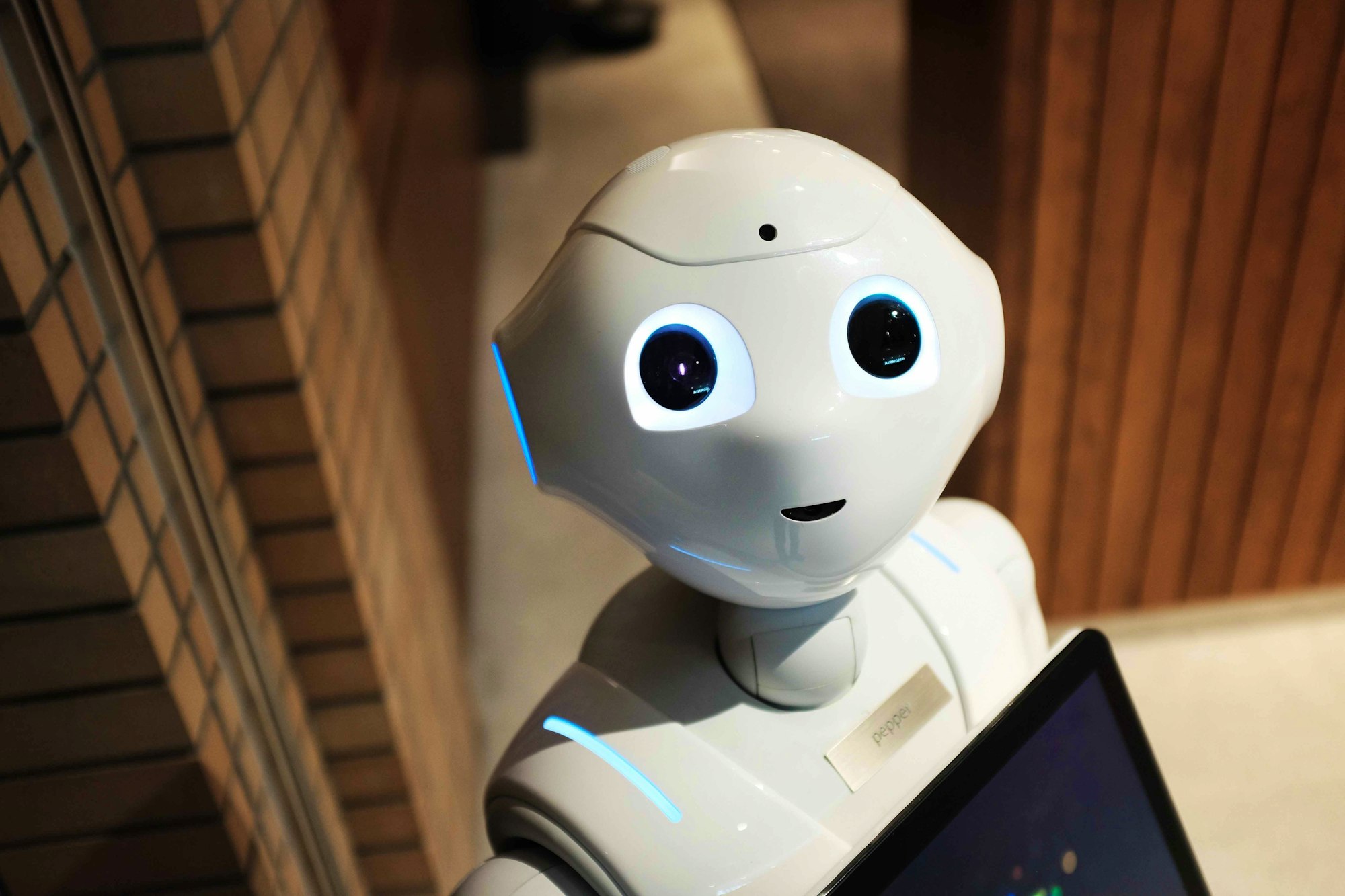 White robot smiling at camera