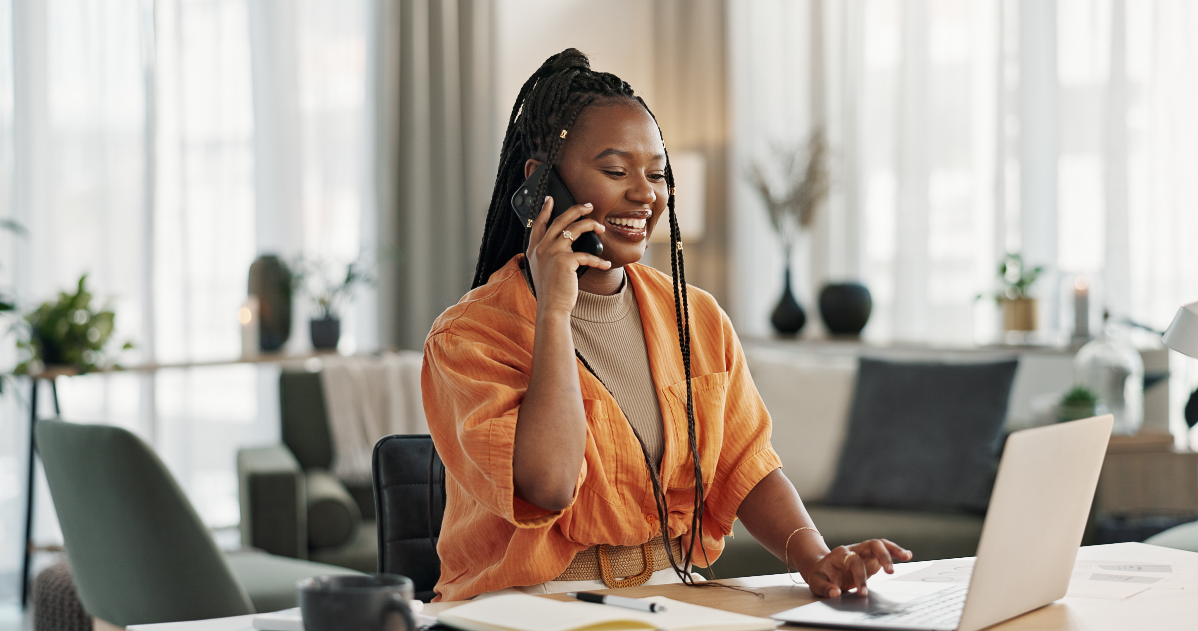 Hard Worker On Phone And Laptop