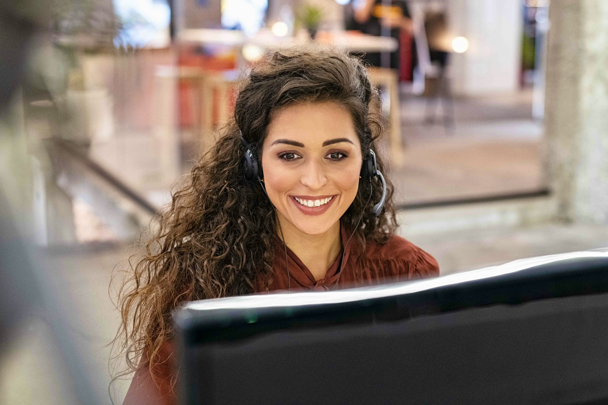 Customer Service Female Representative with Headset Smiling
