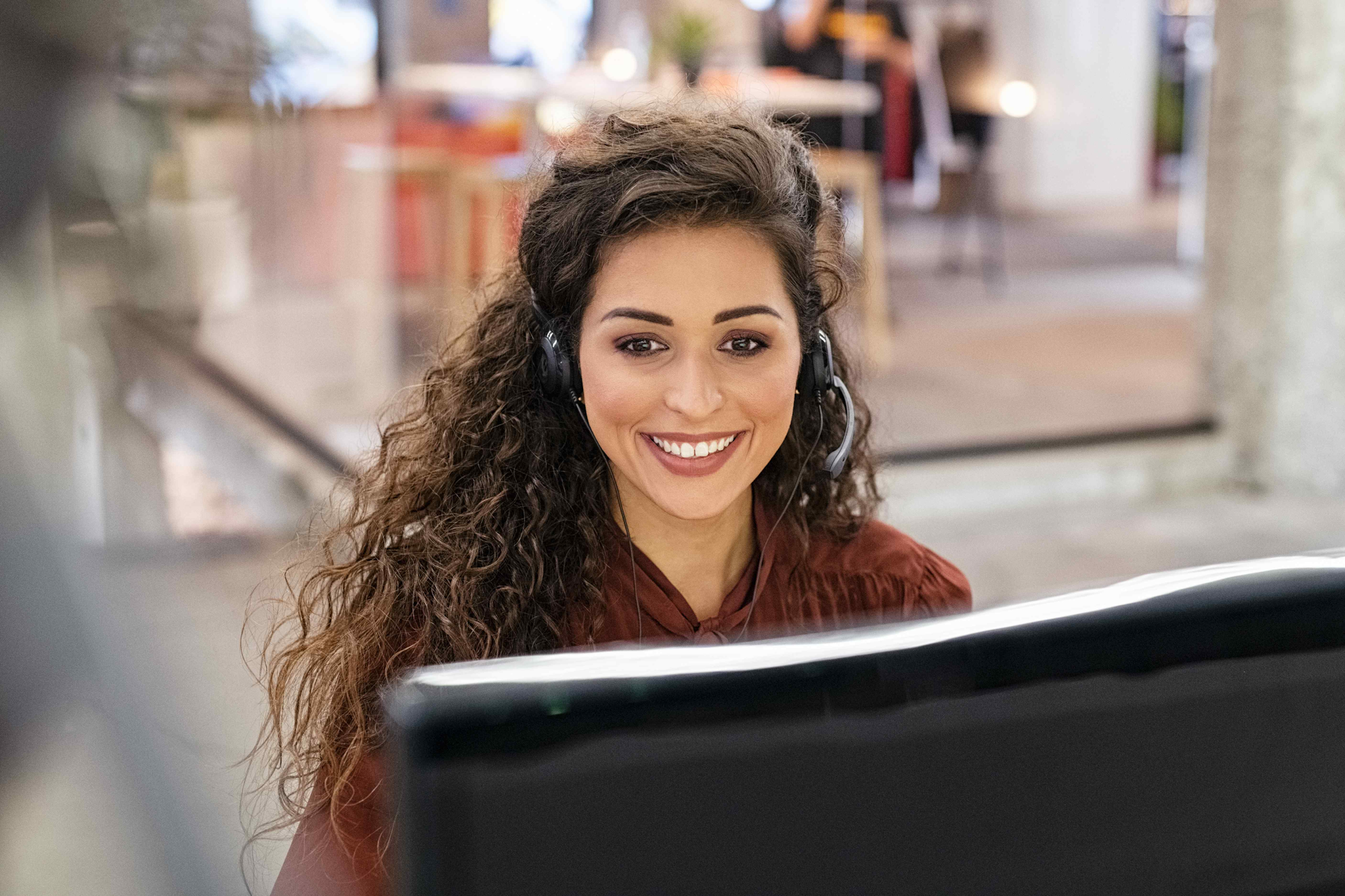 Customer Service Female Representative with Headset Smiling