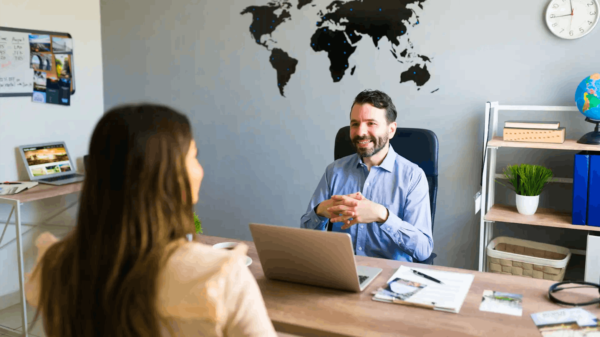 Holuday Maker talking to client